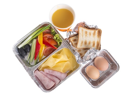 Toasts with vegetables and juice in takeaway dish. Isolated on a white background.の写真素材