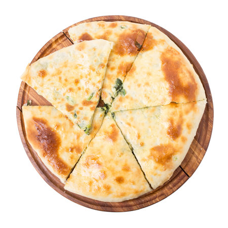 Delicious pie stuffed with spinach. Isolated on a white background.の写真素材