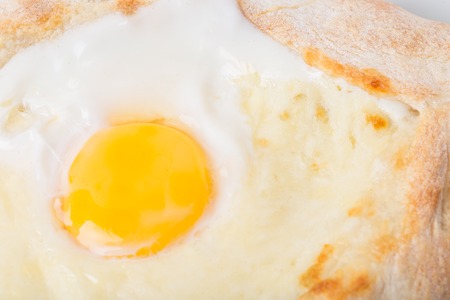 Georgian khachapuri pie with egg and cheese. Macro. Photo can be used as a whole background.の写真素材