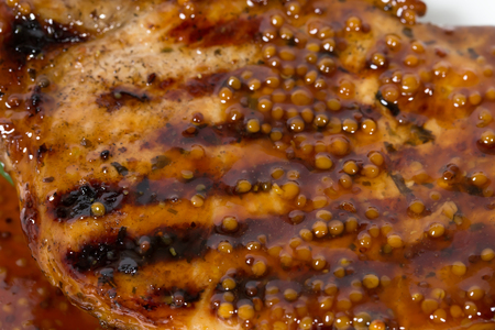 Grilled pork fillet with spinach salad and mustard sauce. Macro. Photo can be used as a whole background.の写真素材