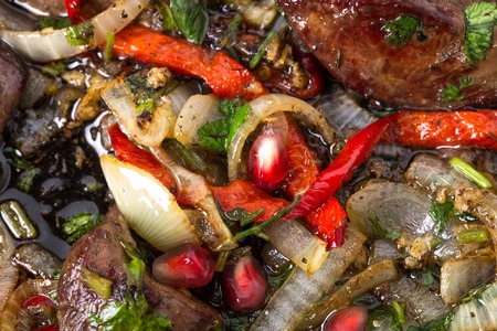 Fried chicken livers with onions and paprika. Macro. Photo can be used as a whole background.の写真素材