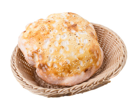 Delicious georgian bread with sesame in wicker basket. Isolated on a white background.の写真素材
