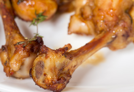 Chicken legs with melted cheese. Macro. Photo can be used as a whole background.の写真素材