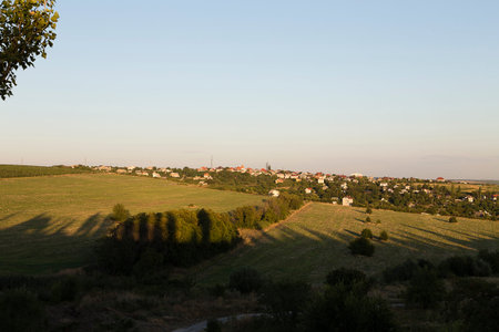 Beautiful rural landscape. There is a village on the slope.の写真素材