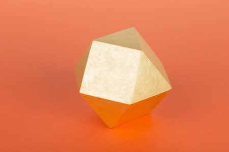 Highest order crystal. Located on the orange background.の写真素材