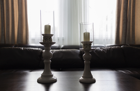 Couple of candleholders. Modern interior of an apartment.の写真素材