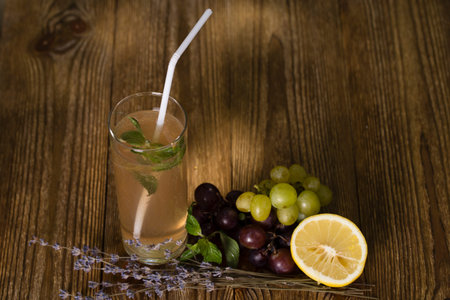 Still life with lemonade. Close up on a wooden background.の写真素材