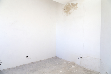 Room before repair. Stains on the wall from the water.の写真素材