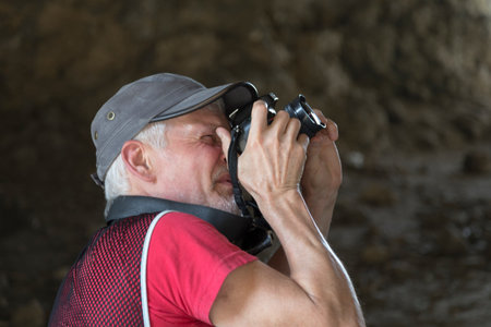 Nature photographer with digital camera. It is a portrait close-up.