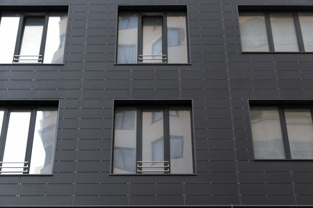 Modern facade of a multi storey building. Contemporary architecture of a multi storey building in Chisinau Republic of Moldova.の写真素材