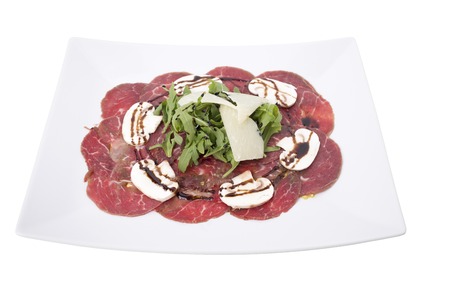Carpaccio meat with parmesan cheese and arugula.の写真素材