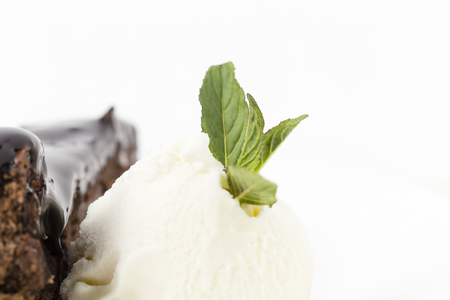 Close-up of chocolate cake on a white background. There is a place for text on a white background.の写真素材