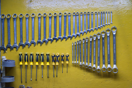 Arrangement of tools on the wall in the workshop. Close-up.の写真素材