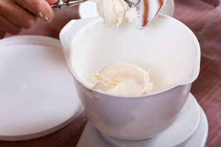 The process of making a cream for confectionery. Close-up.の写真素材