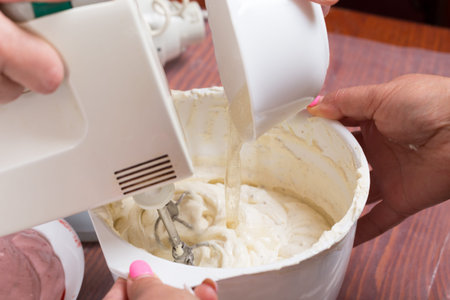 The process of making a cream for confectionery. Close-up.