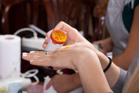 Turmeric poured from a jar onto your hand. Close-up.の写真素材