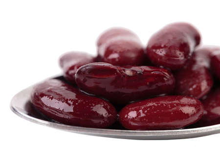 Preserve beans on a spoon. Isolated on a white background.の写真素材