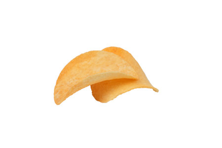 Two goldish deliciouse potato chips. Isolated over white background. Close-up.の写真素材