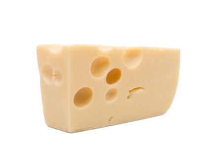 Emmental cheese piece, Swiss cheese. Isolated on white background. High resolution image. Close-up.の写真素材