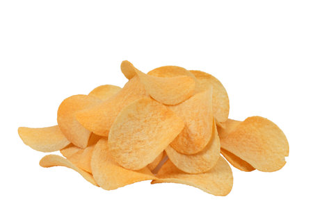 Heap of goldish deliciouse potato chips. Isolated over white background. Close-up.の写真素材