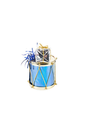 A toy drum for decorating a Christmas tree. Isolated over white background. Close-up.の写真素材