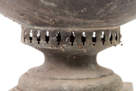 Ash pit of old dirty Russian samovar in a cobweb. It is located on a white background. Close-up.の写真素材