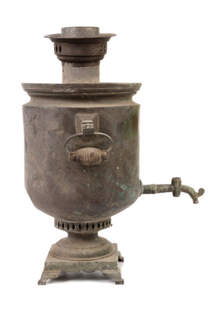 Copper old dirty Russian samovar in a cobweb. isolated over white background. Close-up.の写真素材