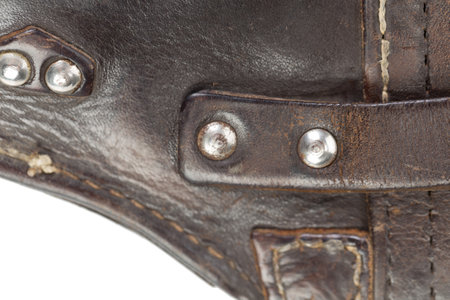 Leather product with rivets and seam. It occupies the entire surface of the image. Close-up.の写真素材