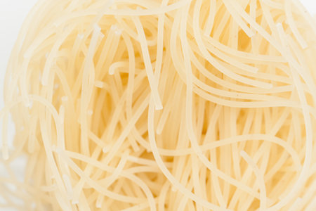 Intricate patterns of boiled noodles. It occupies the entire surface of the image. Close-up.の写真素材