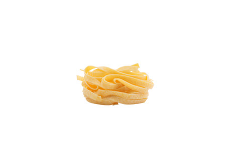 Italian fettuccine pasta in the form of a nest. Isolated over white background. Close-up.の写真素材