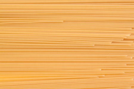 Background of spaghetti durum wheat. It occupies the entire surface of the image. Close-up.の写真素材