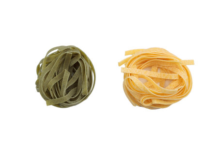 Italian fettuccine pasta in the form of a nest. Isolated over white background. Close-up.の写真素材