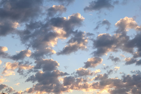 Colorful image of dramatic cloudscape. Amazing clouds of pink, purple, violet, white, gray color on the background of sky at gold time. Panorama view.の写真素材