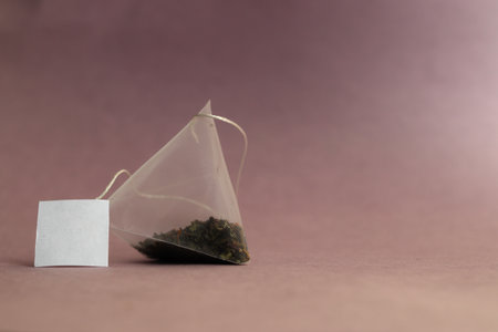 Green tea bag on a table. Close-up. There is a place for the text.の写真素材