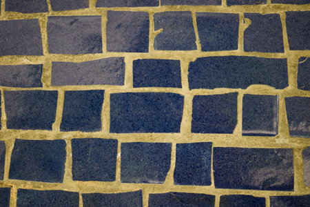 The background is made using mosaic masonry. Close-up.の写真素材