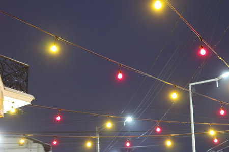 Colored lanterns light at night. A blurred night sky in a haze.の写真素材