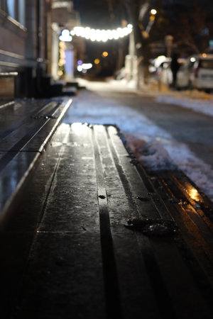 The color and light of the night city. The reflection of the festive lanterns on the steps of the mansion.の写真素材