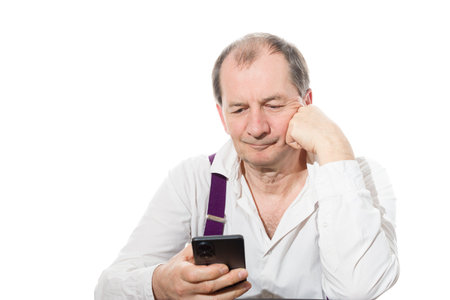 Portrait of a sixty-year-old man in a white shirt. Isolated over white background. Close-up.の写真素材