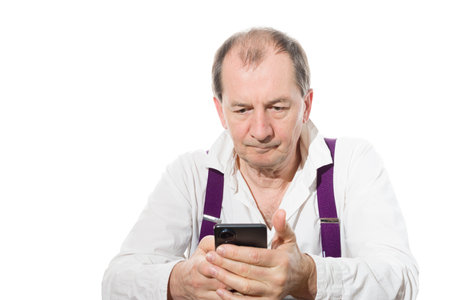 Portrait of a sixty-year-old man in a white shirt. Isolated over white background. Close-up.の写真素材