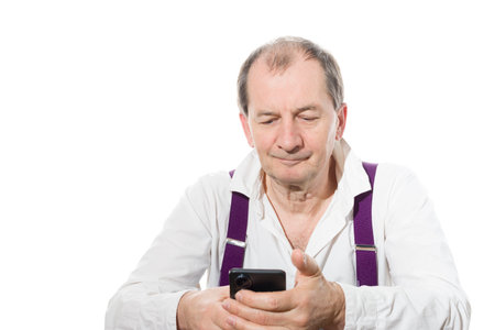 Portrait of a sixty-year-old man in a white shirt. Isolated over white background. Close-up.の写真素材