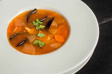Tasty mussel soup with carrots. Traditional food. Restaurantの写真素材