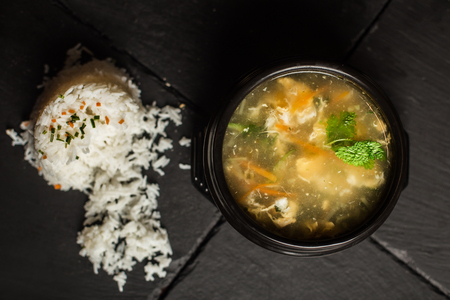 Chinese chicken soup with rice. Traditional food. Restaurantの写真素材