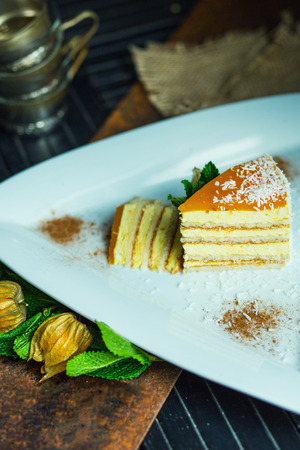 Fresh passion fruit cake with coconut and cinnamon. Dessert on plate. The restaurant or cafe atmosphereの写真素材