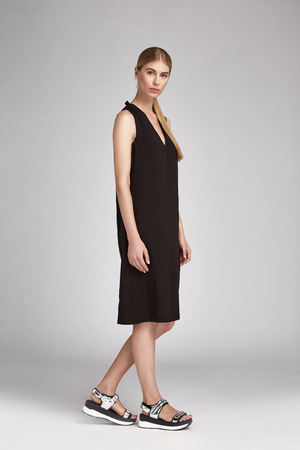Beautiful glamour sexy woman blonde hair wear long black silk or cotton fashion style dress accessory shoes natural beauty makeup perfect body shape clothes for meeting walk party date casual modernの写真素材