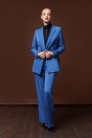Beautiful sexy woman wear for meeting date business style suit jacket pants accessory fashion collection shoes model pose long blond hair natural make up businesswoman casual clothes.の写真素材
