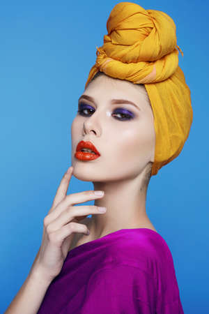 Portrait of young beautiful perfect sexy woman with long smooth hair well-groomed, fashionable styling hair, evening make-up organic cosmetics, facial features in a beauty salon.の写真素材