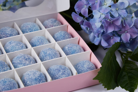 Blue fresh flower hydrangea green leaf and big box with sweets candy blue sugar free organic healthy...