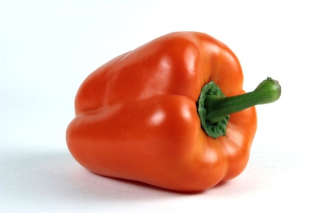 Orange pepper with green stem isolated on white backgroundの写真素材