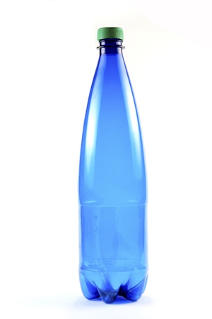 Blue bottle with green cap on white backgroundの写真素材