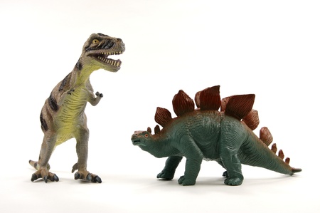 Two toy dinasours on white back groundの写真素材